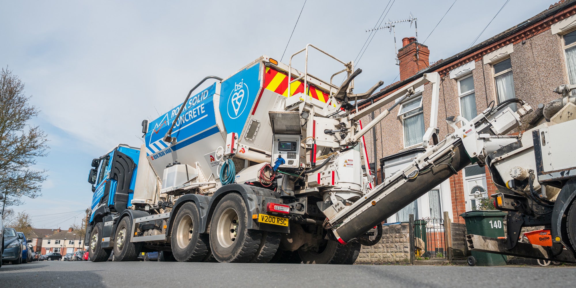 Volumetric concrete mixer pouring on site